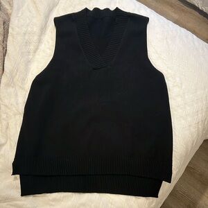 Black oversized sweater vest.